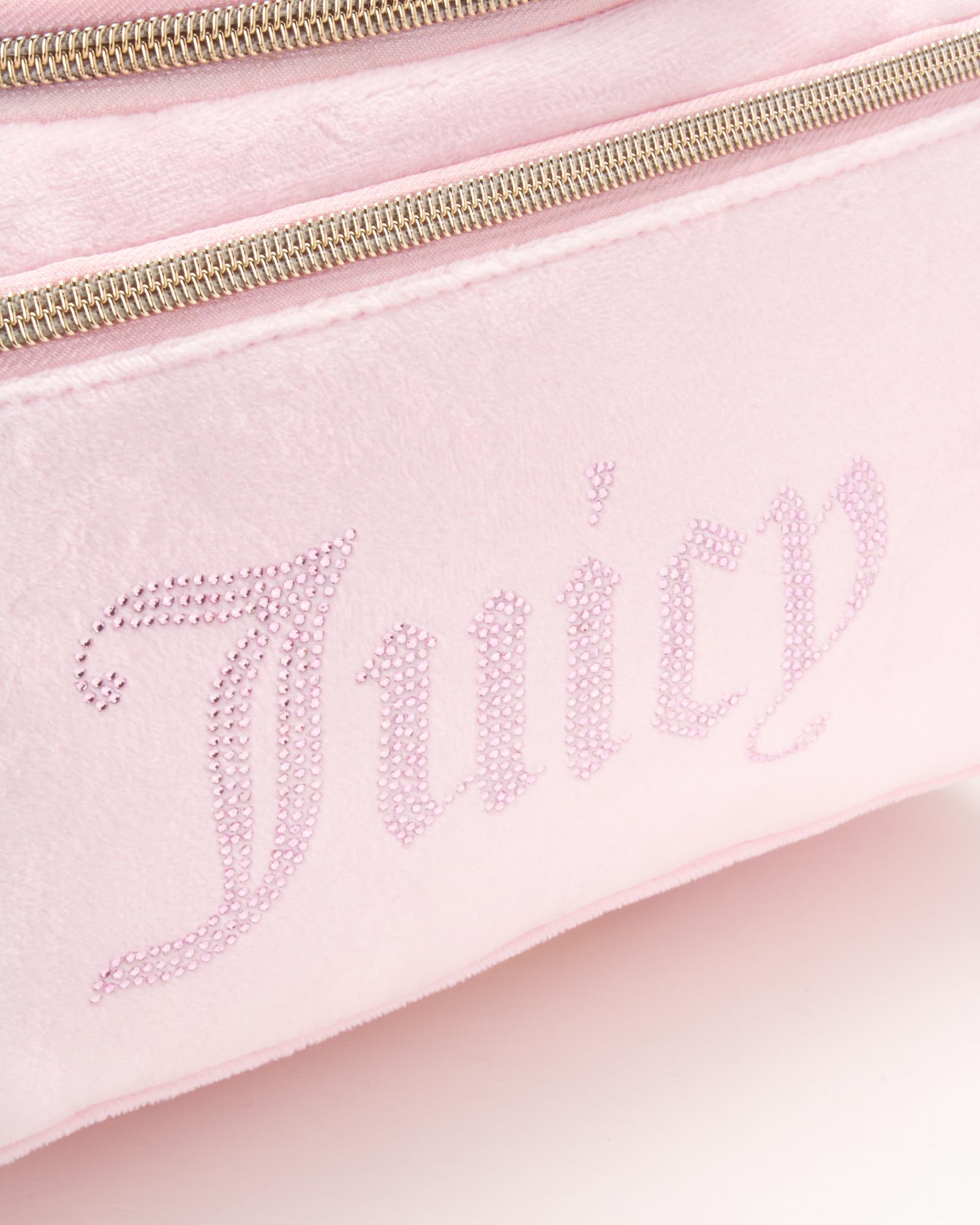 Juicy Couture pink makeup bag velour finish adds stylish travel charm.