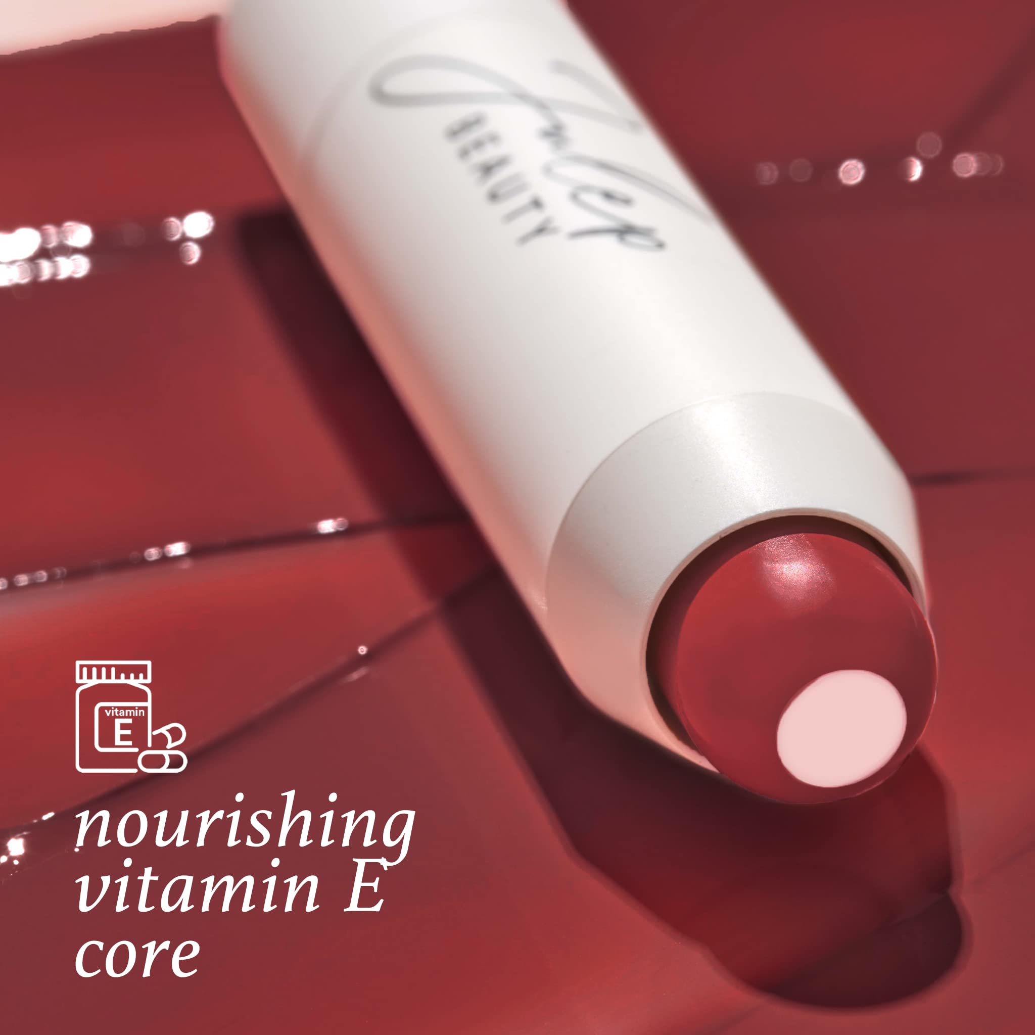 Julep balm texture close-up reveals creamy core with Vitamin E for nourishment.
