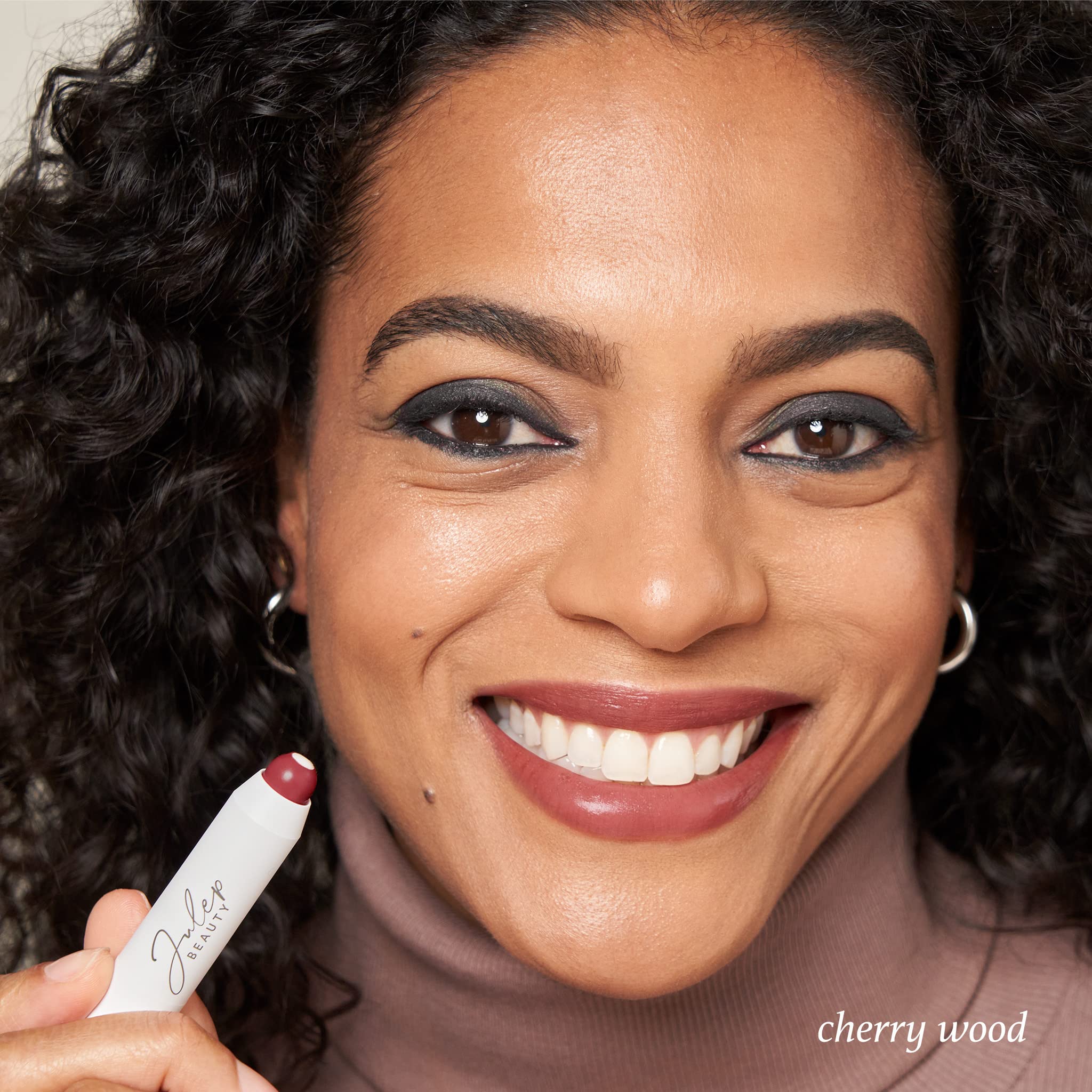Julep Cherry Wood Creme close-up highlights Vitamin E core for hydrated lips.
