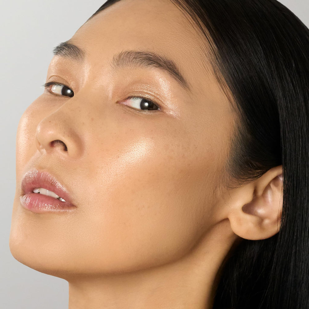 Julep Skip The Brush stick applied on cheek demonstrates soft radiant finish.
