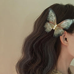 Jumwrit butterfly hair clip set features 3D moving wings for playful styles.