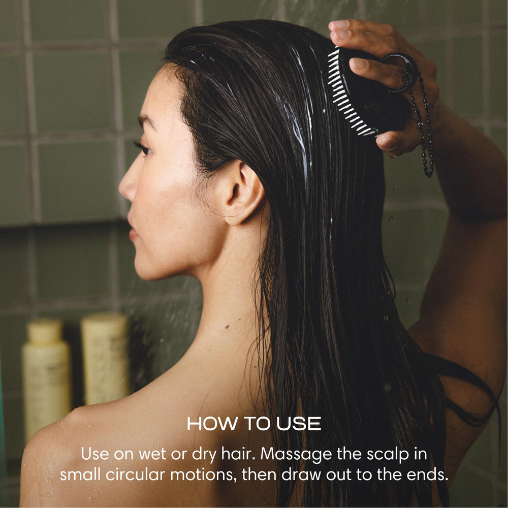 Jupiter scalp exfoliator on wet hair demonstrating detangling and smoother, shinier strands