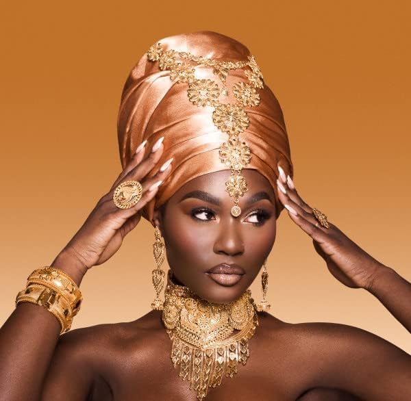 Juvia's Place Nubian Earth vanilla shimmer highlight for subtle glow.