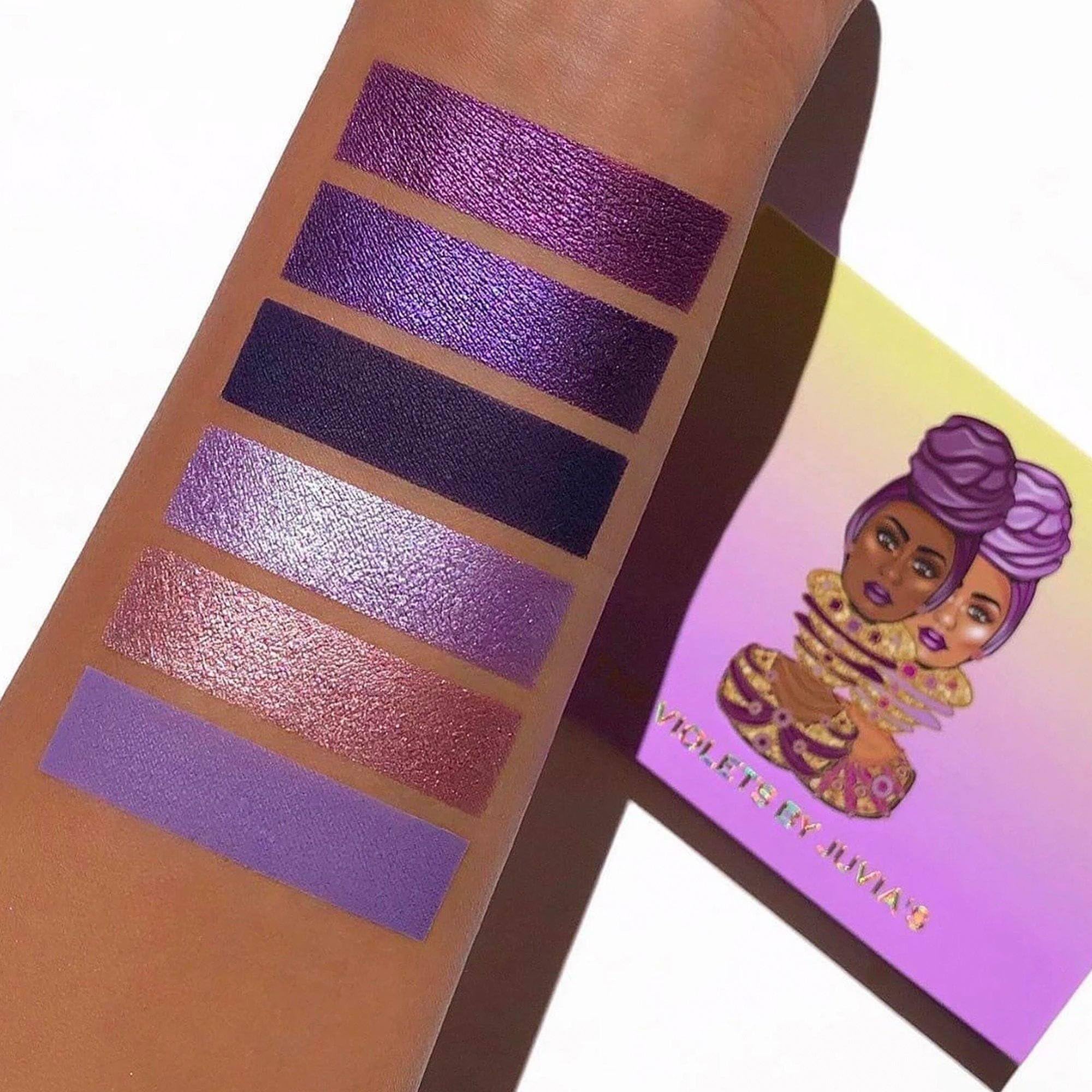 Juvia's Place The Violets application guide demonstrates brush technique for even pigment.