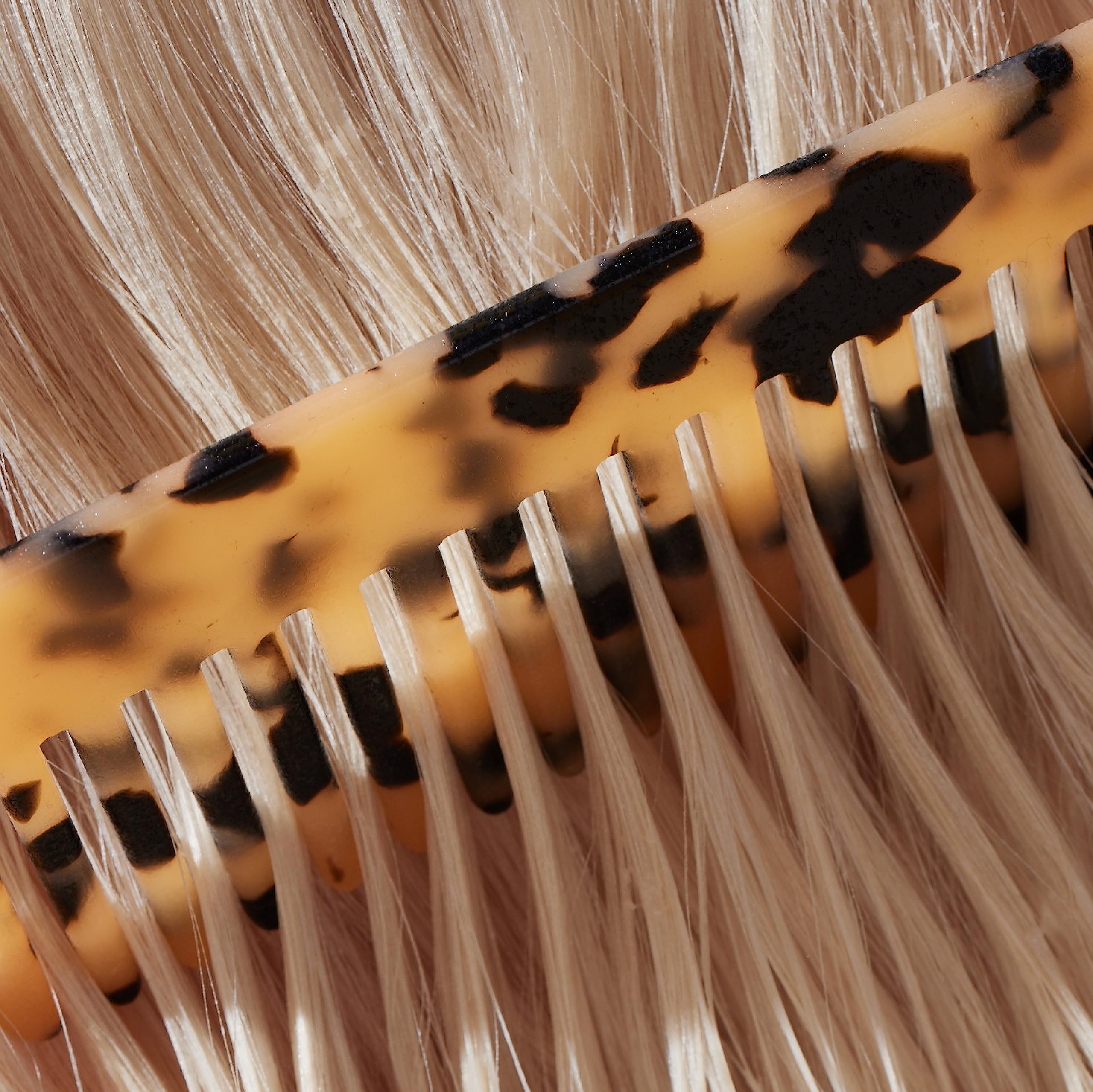 JVN Complete Leave-In Mist bottle and spray nozzle enables quick, even misting on the go.