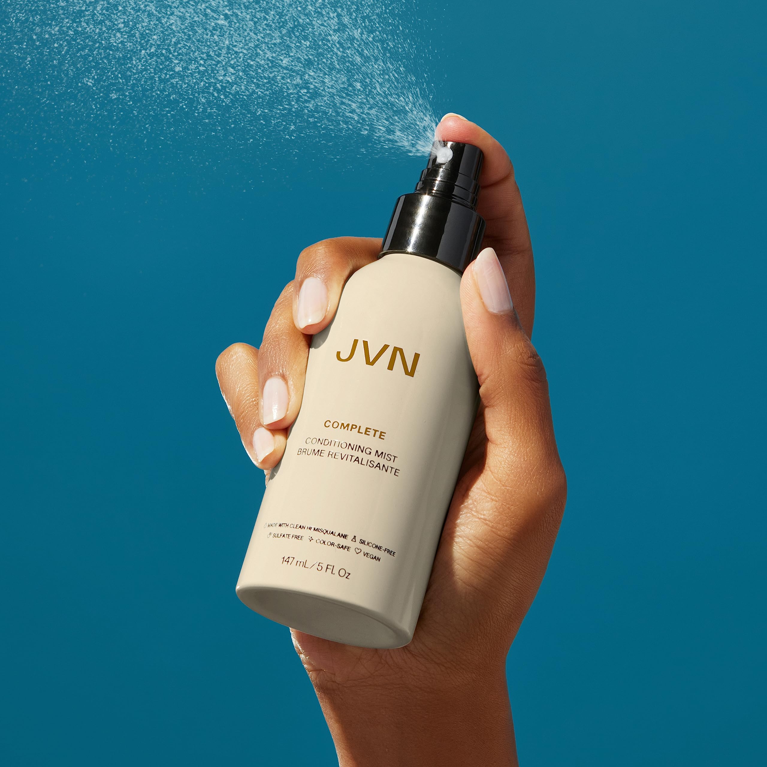 JVN Complete Leave-In Mist bottle label notes UV protection for color-safe styling.