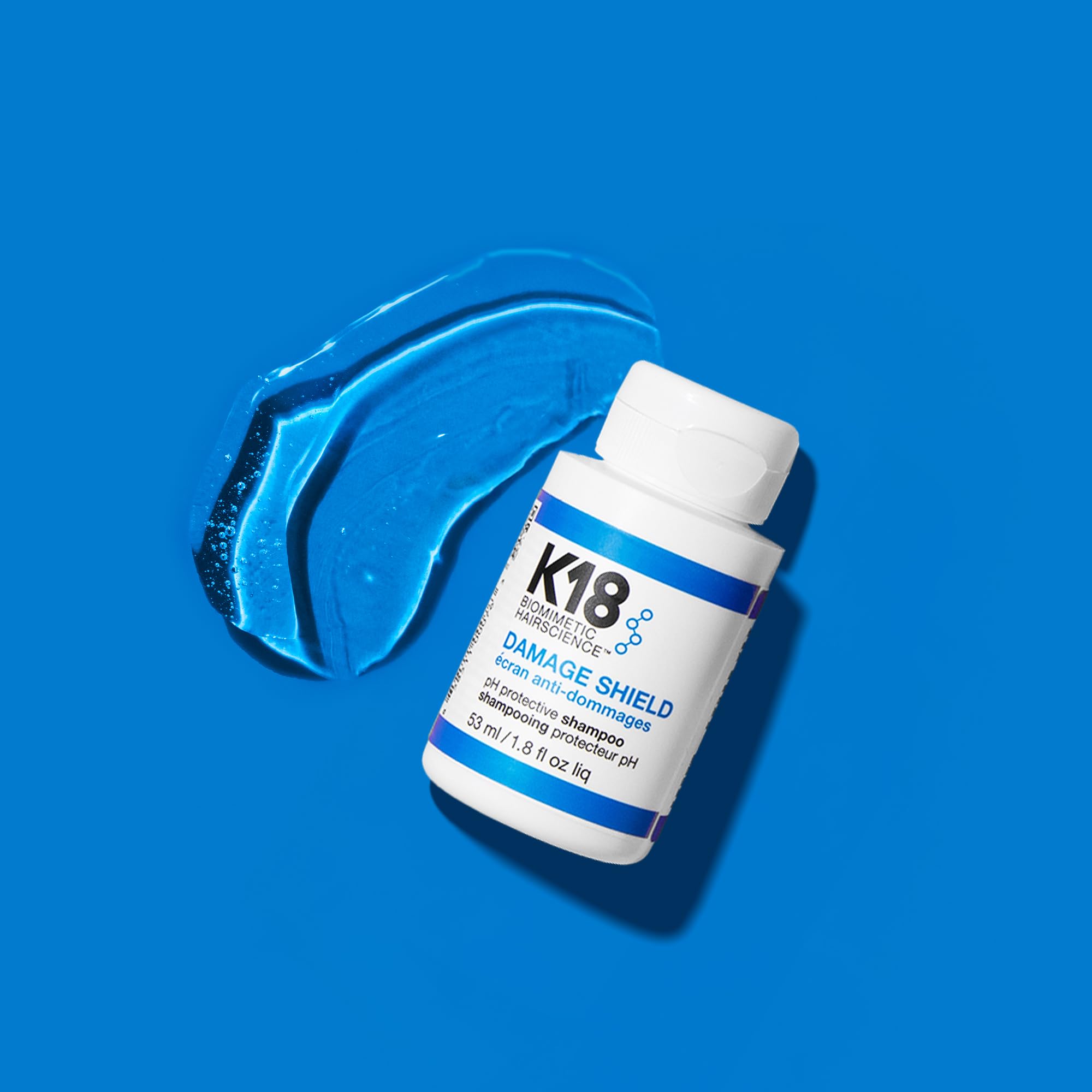 K18 Damage Shield lather close-up highlights gentle cleansing for damaged hair.