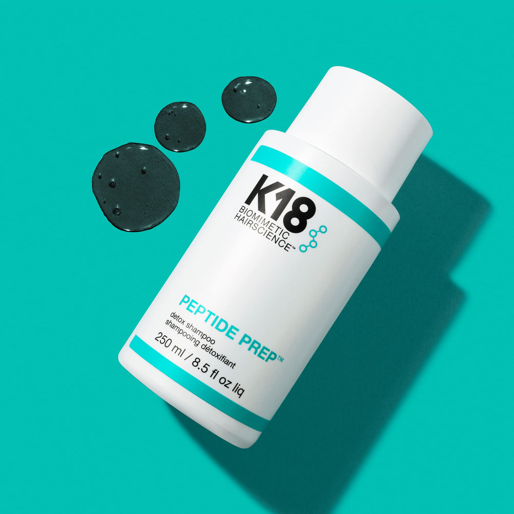 K18 PEPTIDE PREP Detox Shampoo being applied to scalp for a thorough cleanse
