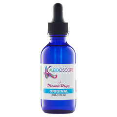 KALEIDOSCOPE MIRACLE DROPS bottle pouring, delivering quick-absorbing scalp oil for refreshed, nourished hair.