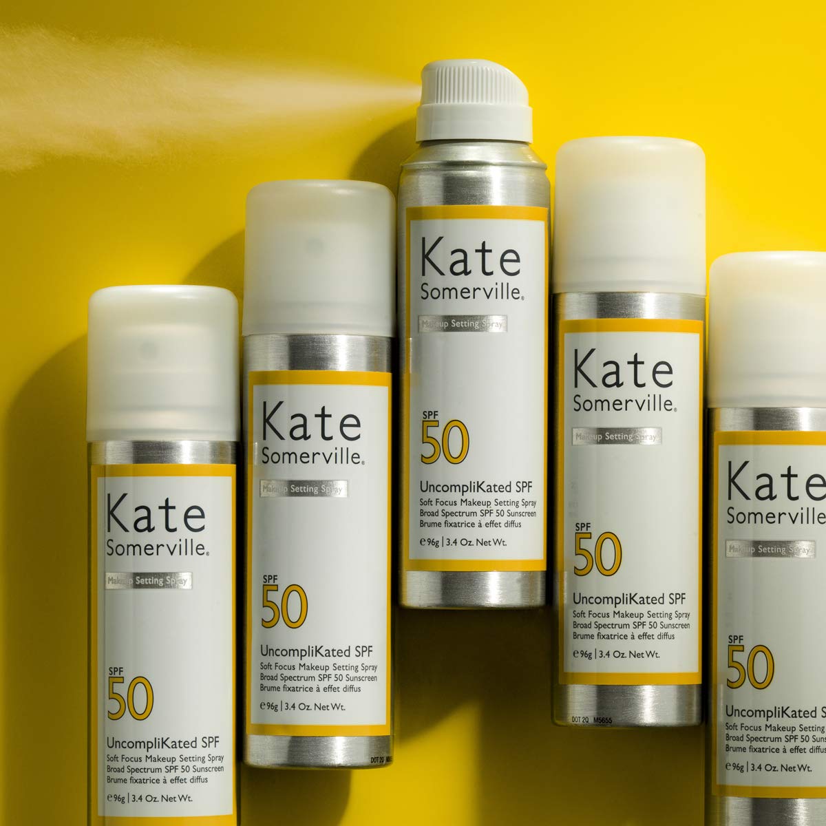 Kate Somerville UncompliKated SPF 50 daily-use bottle shown in hand.