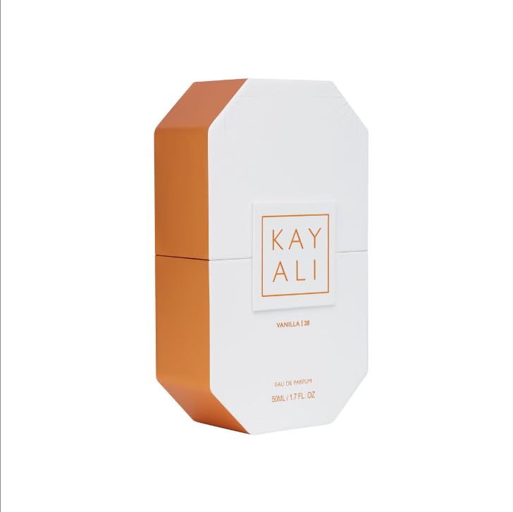Kayali Vanilla 28 bottle on glass surface captures luminous glow and elegance.