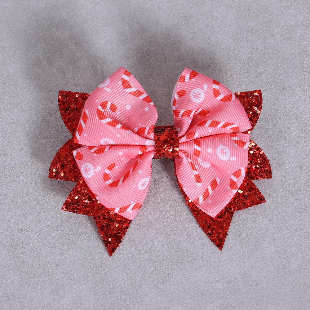 KCHIES holiday-style setup with bow suggests coordinated sisters or family looks.