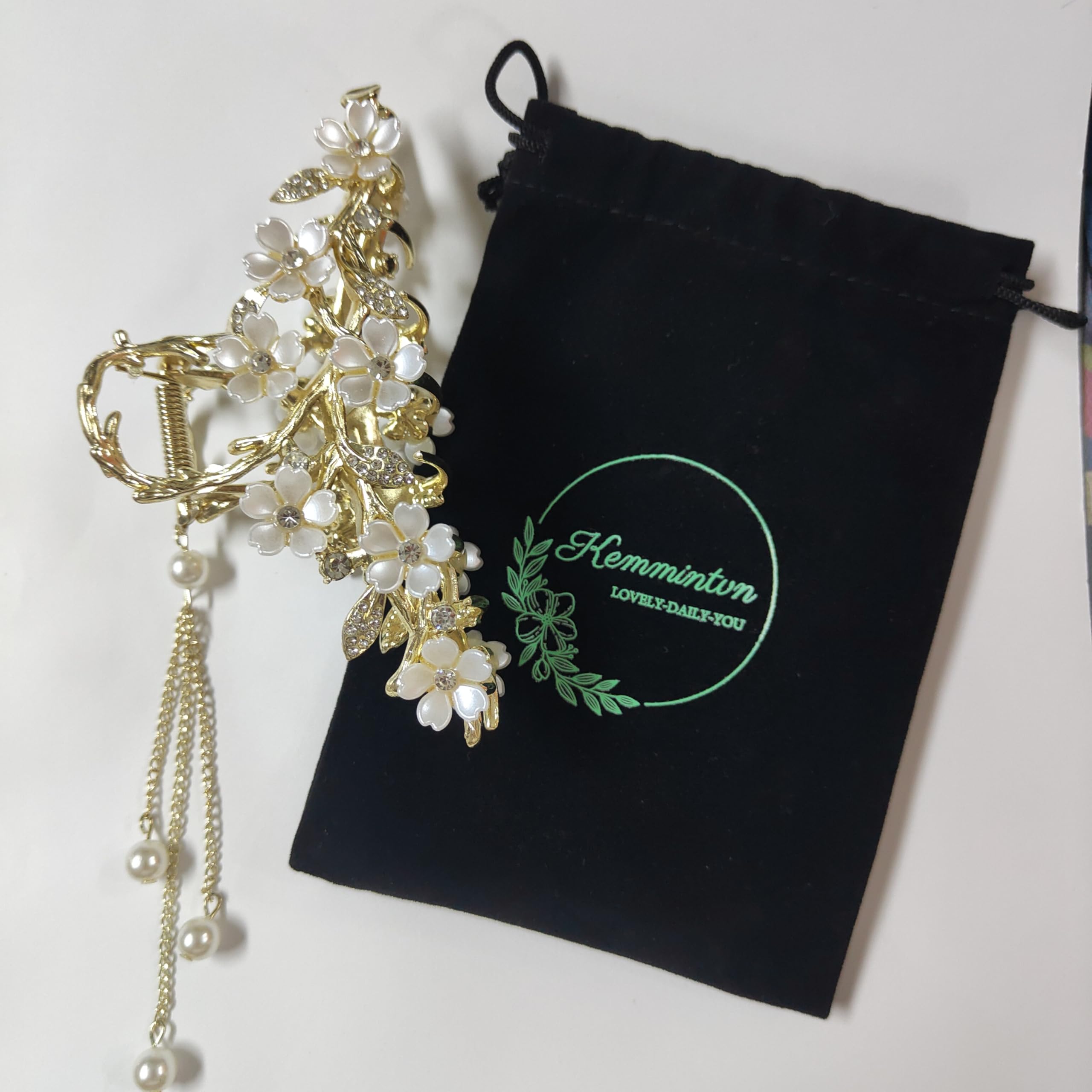 KEMMINTVN Pearl tassel bun holder showcases dangling pearls for sophisticated everyday styling.