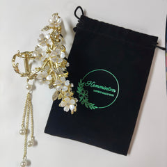 KEMMINTVN Pearl tassel bun holder showcases dangling pearls for sophisticated everyday styling.