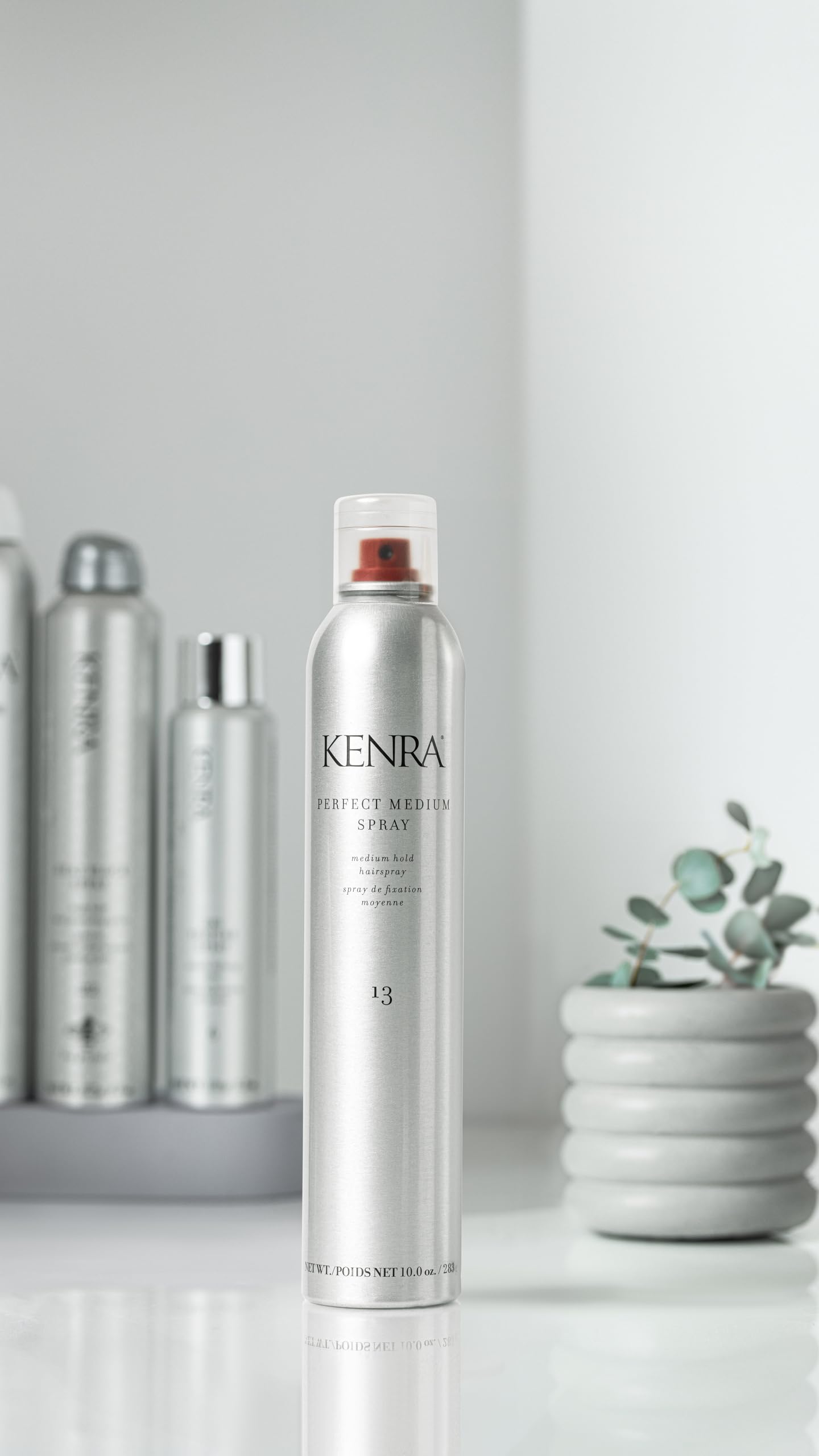 Kenra Perfect Medium Spray 13 hair application scene showing brush-through hold
