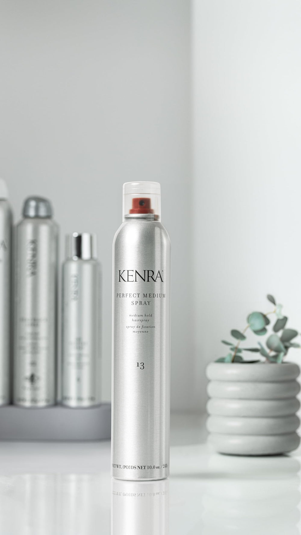 Kenra Perfect Medium Spray 13 hair application scene showing brush-through hold