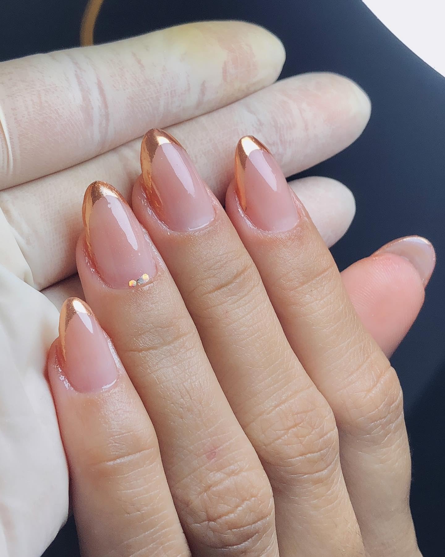 Kepovin Gold French Tip nails on hand showing quick glossy almond manicure