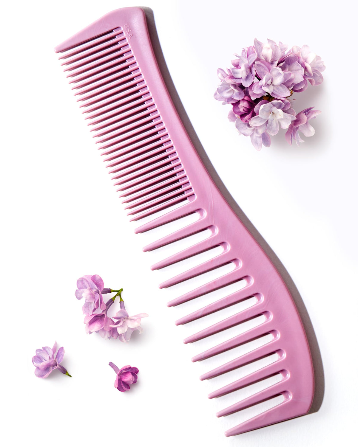Keranique detangling comb wide-tooth for even conditioner distribution and knot-free styling.