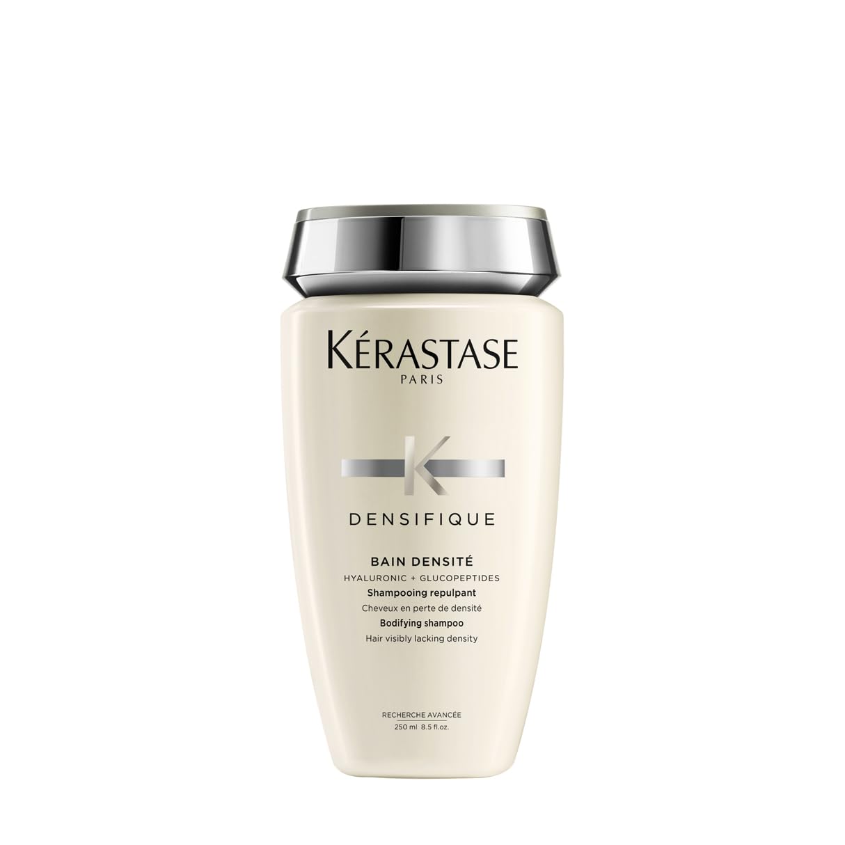 KÉRASTASE Densifique shampoo bottle promotes thicker hair appearance.