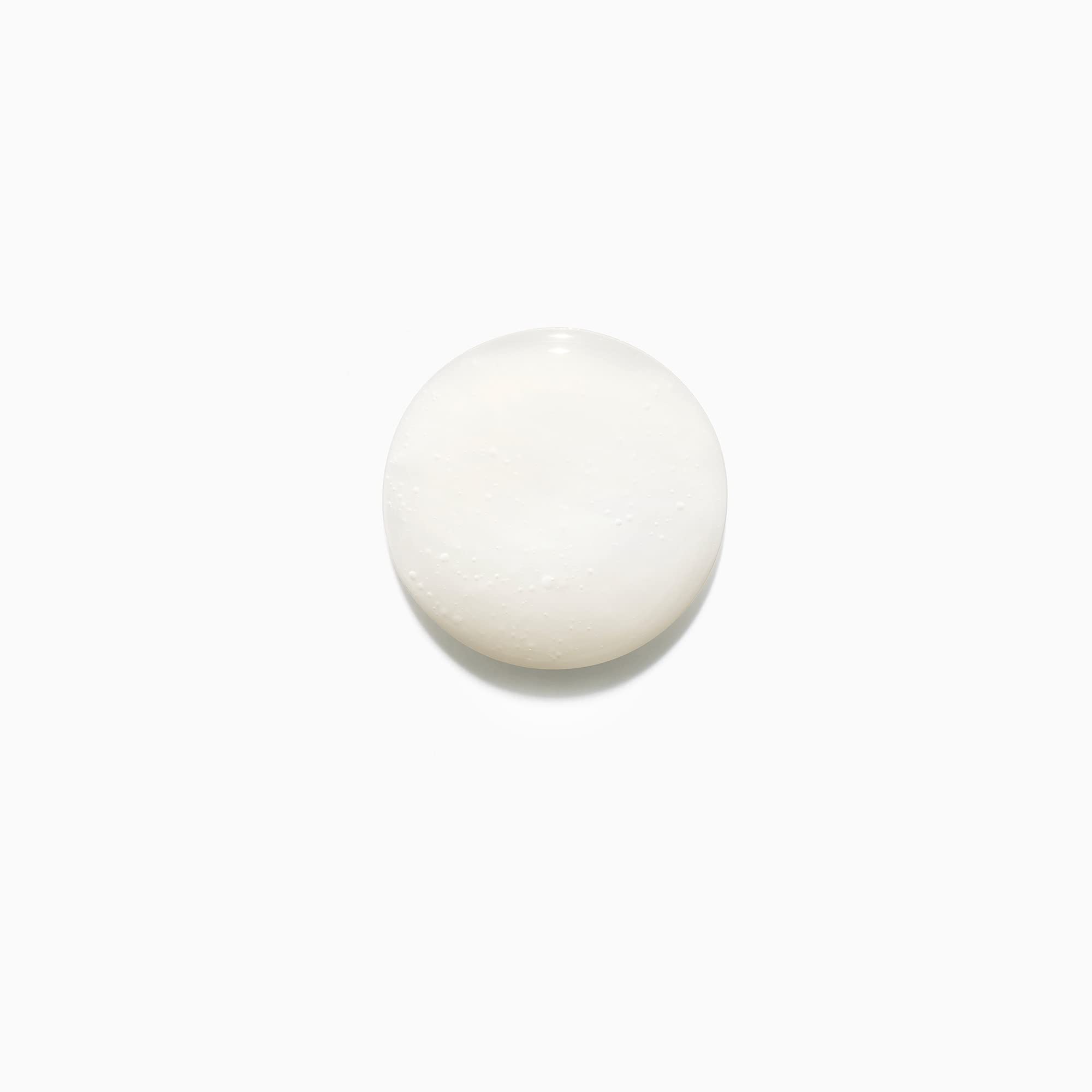 KÉRASTASE Discipline Bain Fluidealiste after-wash hair reveals smooth texture and shine.