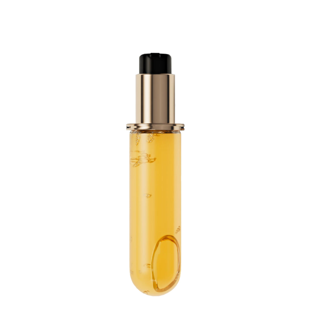 KÉRASTASE Elixir Ultime bottle pour shows glossy shine and smooth texture.