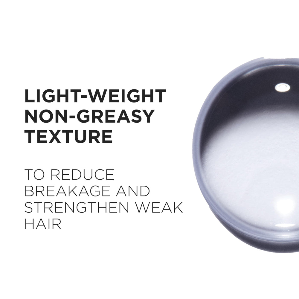 Kérastase Genesis massage application demonstrates thorough distribution for nourished hair.