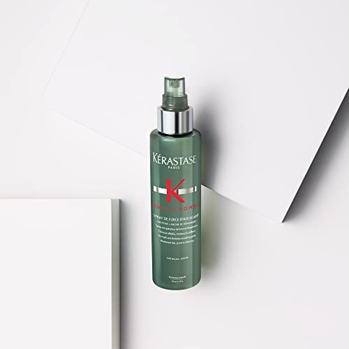 Kérastase Genesis Homme Spray De Force hands-on application through hair for thickening