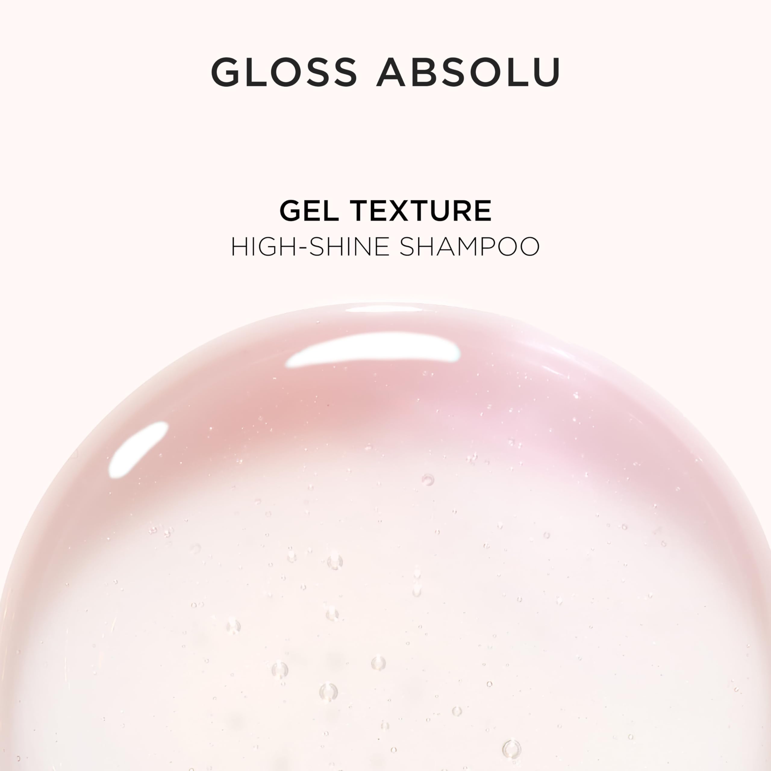 KÉRASTASE Gloss Absolu pump-top bottle on vanity emphasizes convenient daily use.
