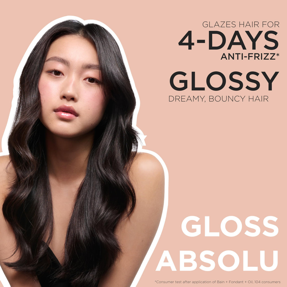 Kerastase Gloss Absolu travel-size pack fits in bags for on-the-go routines.