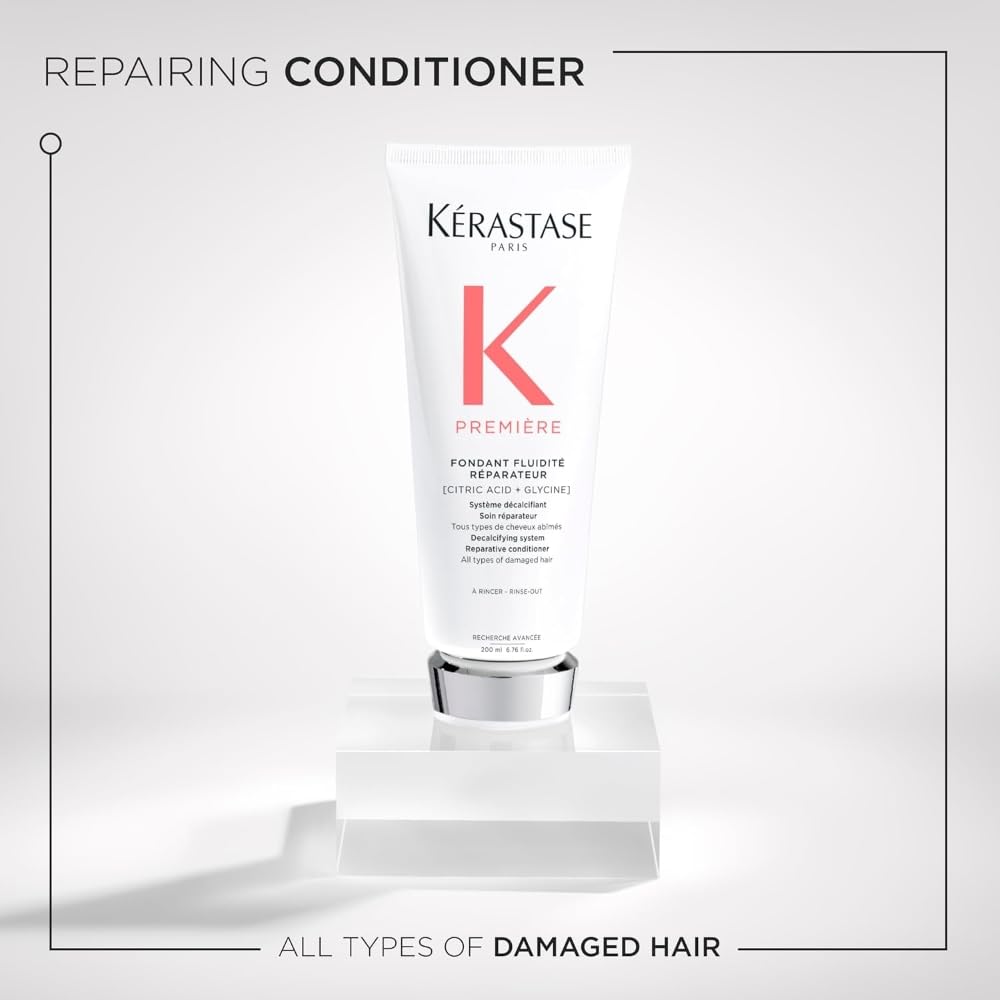 Kérastase Premiere conditioner applied to towel-dried hair for deep hydration.