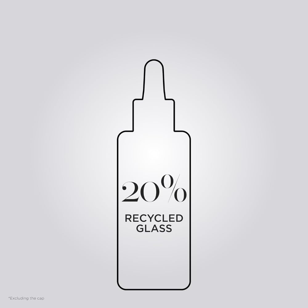 KÉRASTASE Première Repairing Gloss Oil routine shot hints at at-home repair and daily shine ritual.