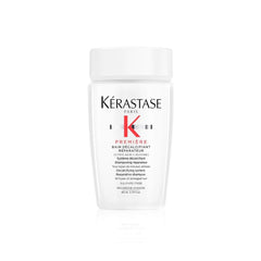 KÉRASTASE Première sulfate-free shampoo bottle demonstrates dual-action cleansing for stronger hair.
