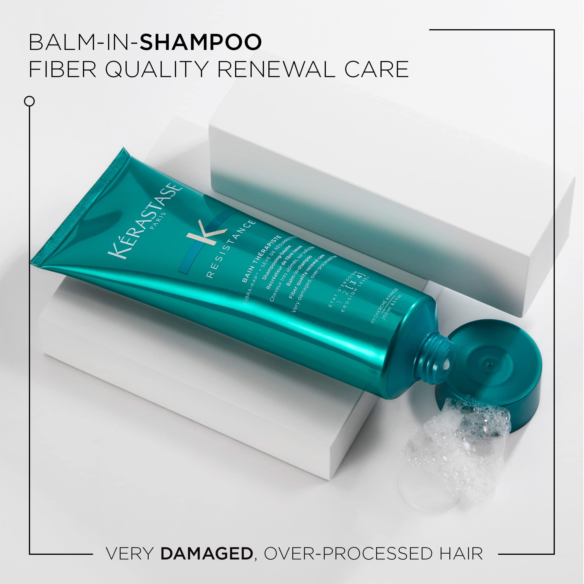 KÉRASTASE Resistance Bain Therapiste label close-up signaling professional hair repair benefits.