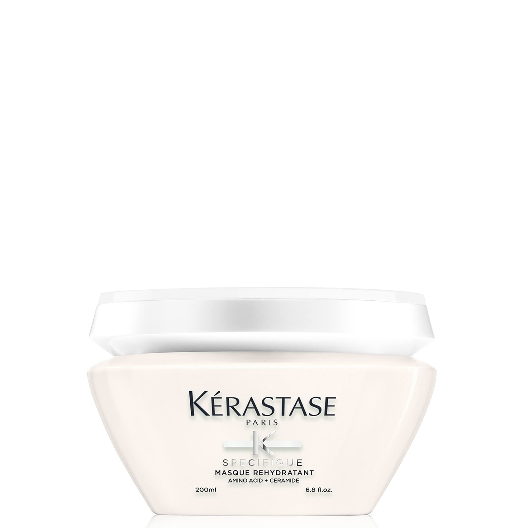 KÉRASTASE Specifique Rehydratant bottle close-up showing lightweight hydration for sensitive hair.