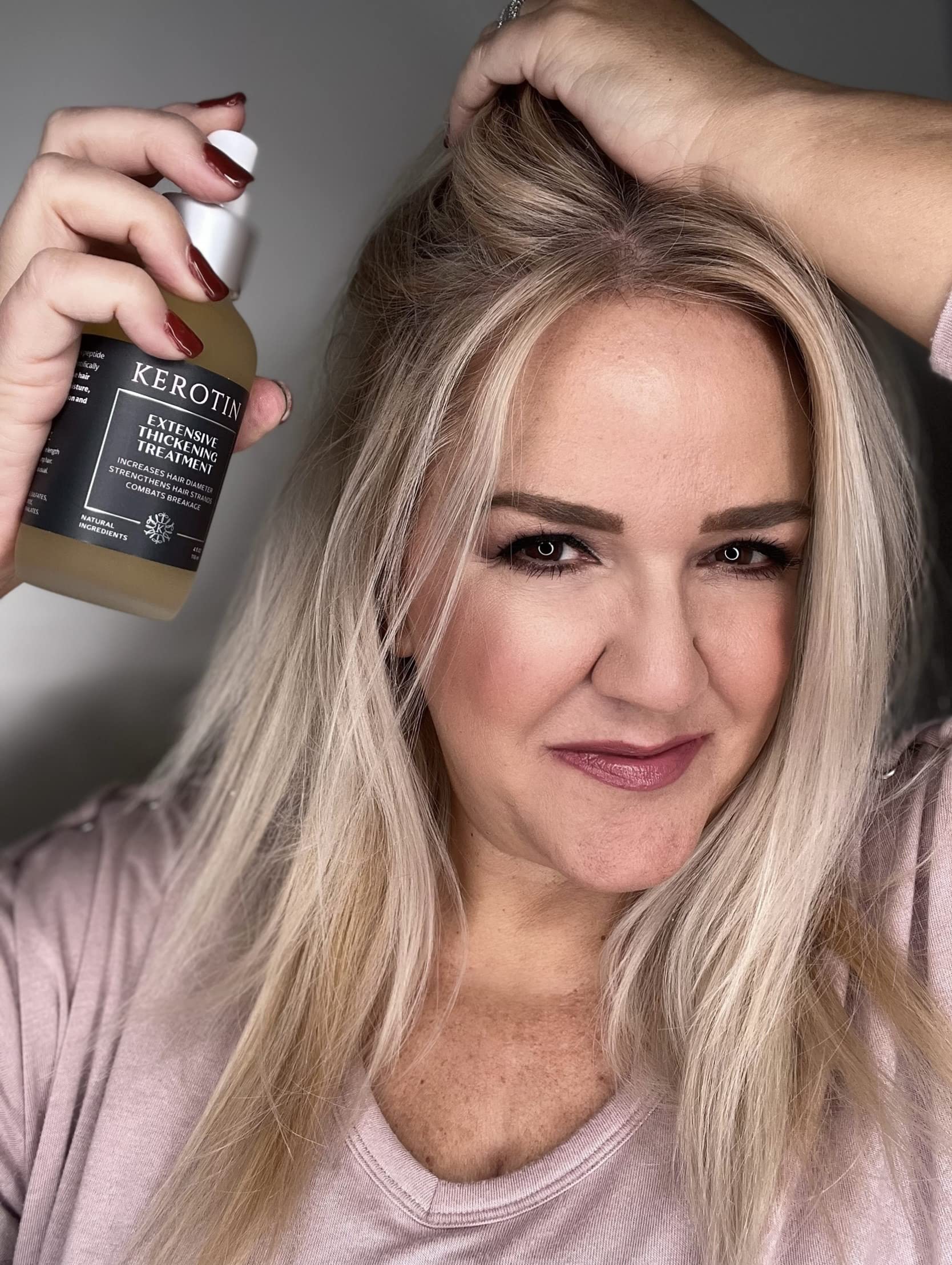 Kerotin heat-protection mist demonstrates protective layer during styling.