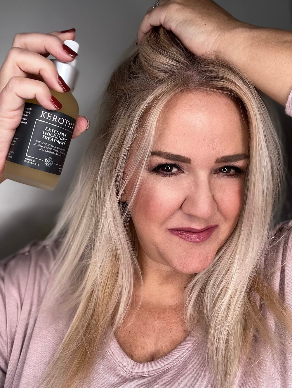 Kerotin heat-protection mist demonstrates protective layer during styling.
