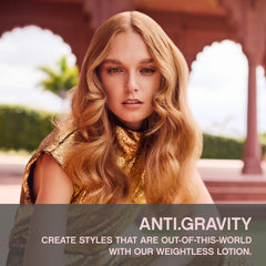 KEVIN.MURPHY ANTI.GRAVITY bottle pour demonstrates easy release for quick styling.