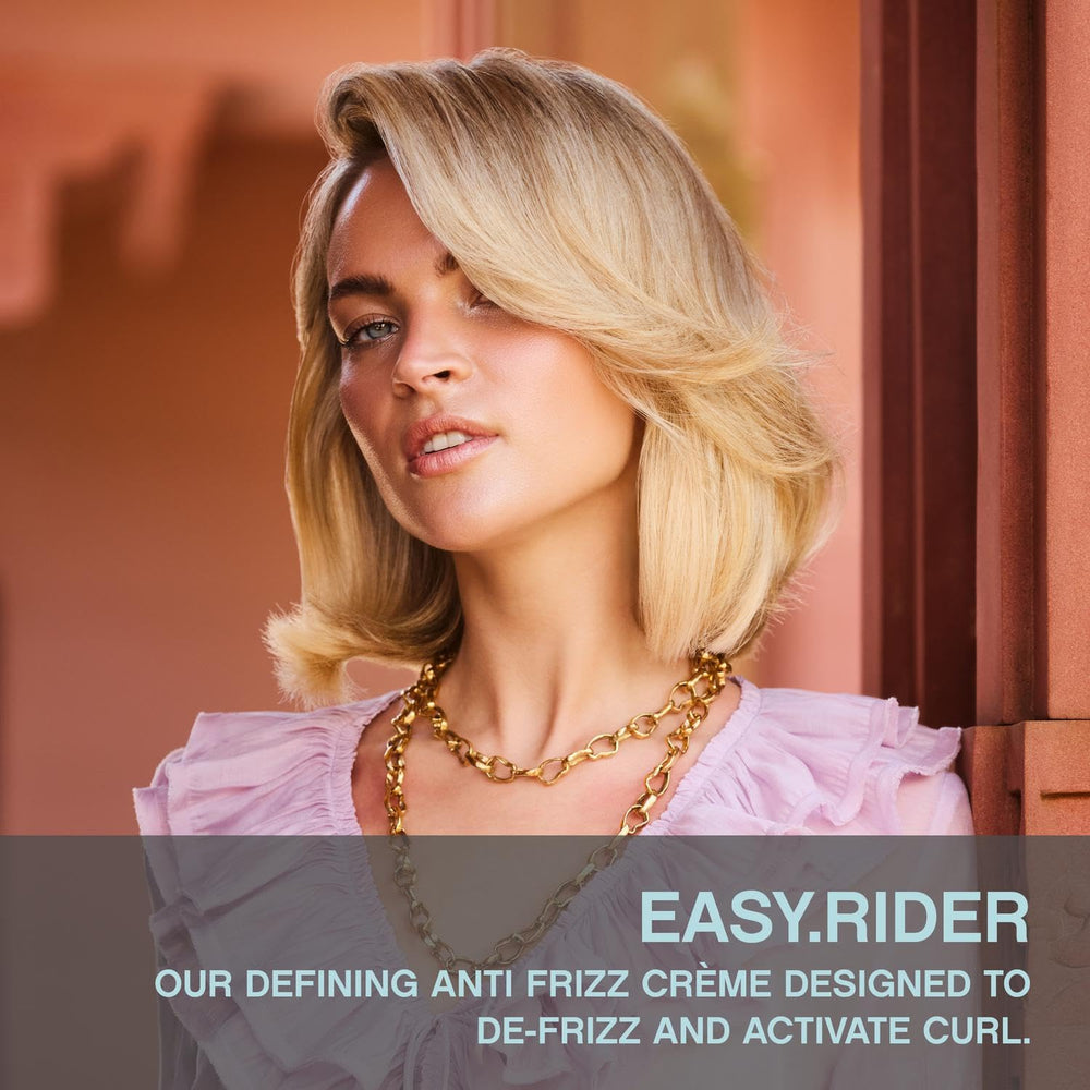 KEVIN.MURPHY EASY.RIDER hands applying cream for flexible hold and nourishment.