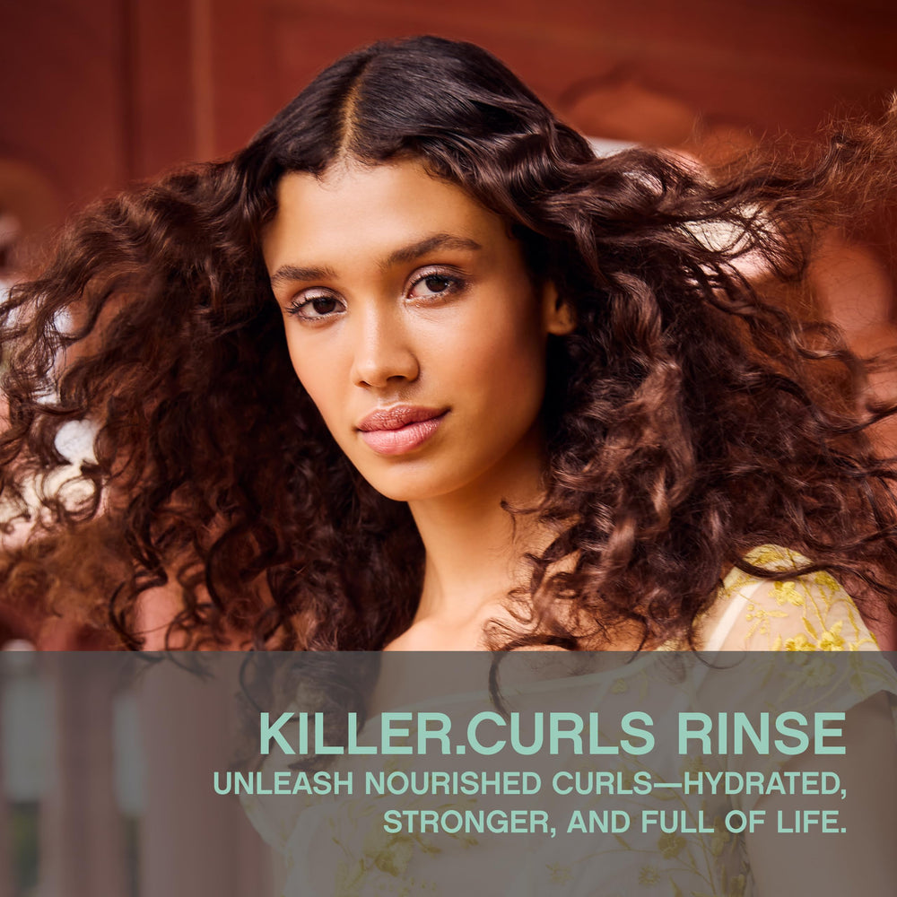 KEVIN.MURPHY KILLER.CURLS RINSE applied to damp hair for soft, defined curls.