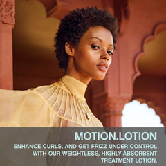 KEVIN.MURPHY MOTION.LOTION close-up of defined curls for natural texture.