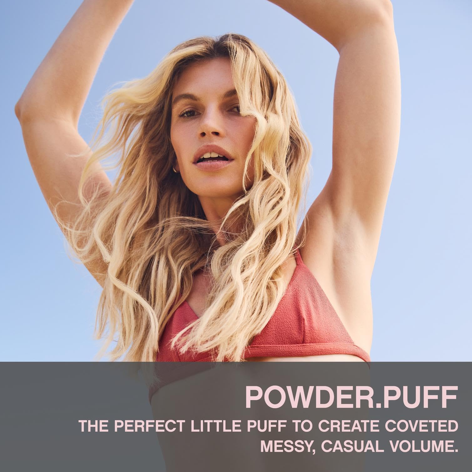 Kevin Murphy Powder Puff bottle in hand demonstrates easy styling and added volume.