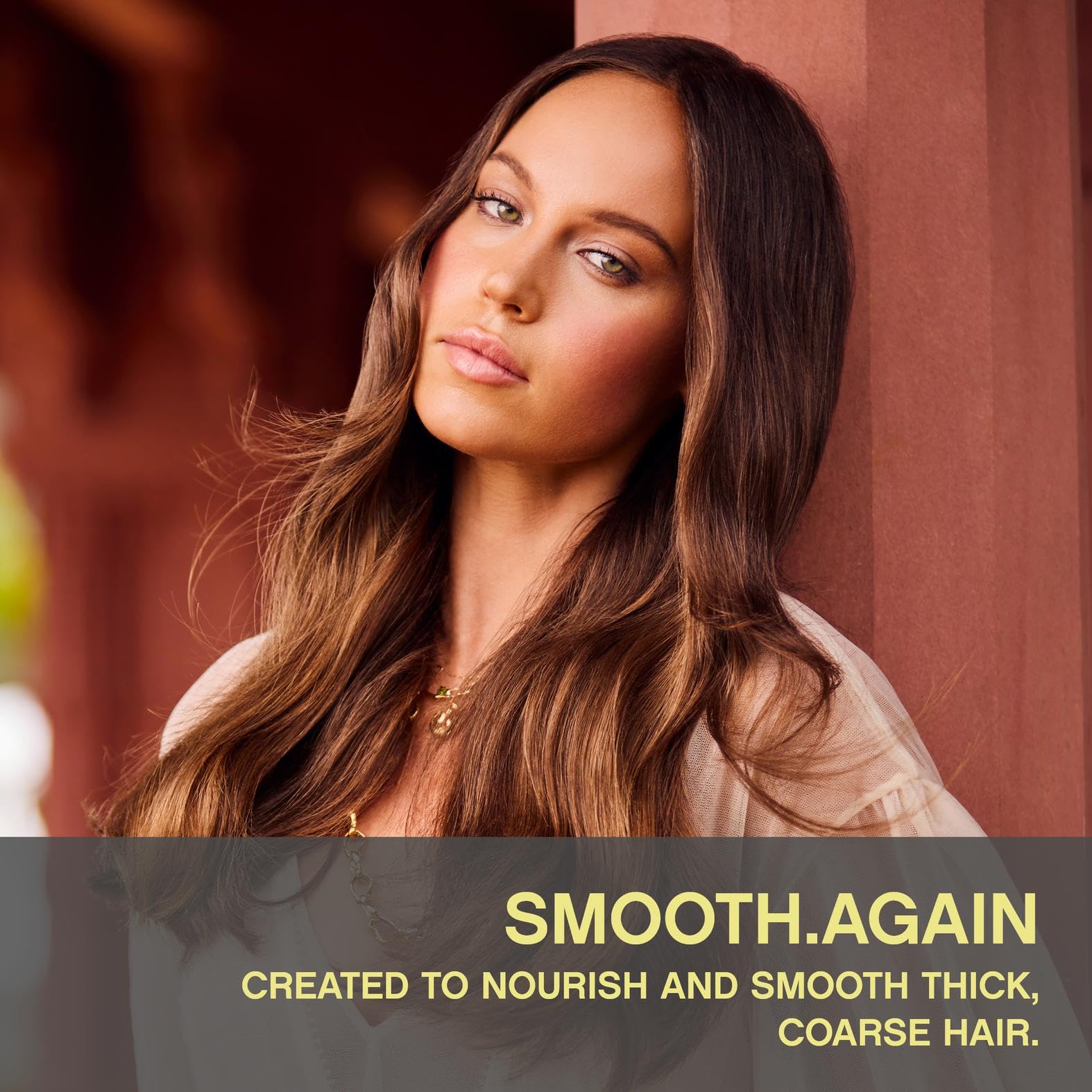 KEVIN.MURPHY SMOOTH.AGAIN bottle closeup highlights nourishing formula for thick, coarse hair