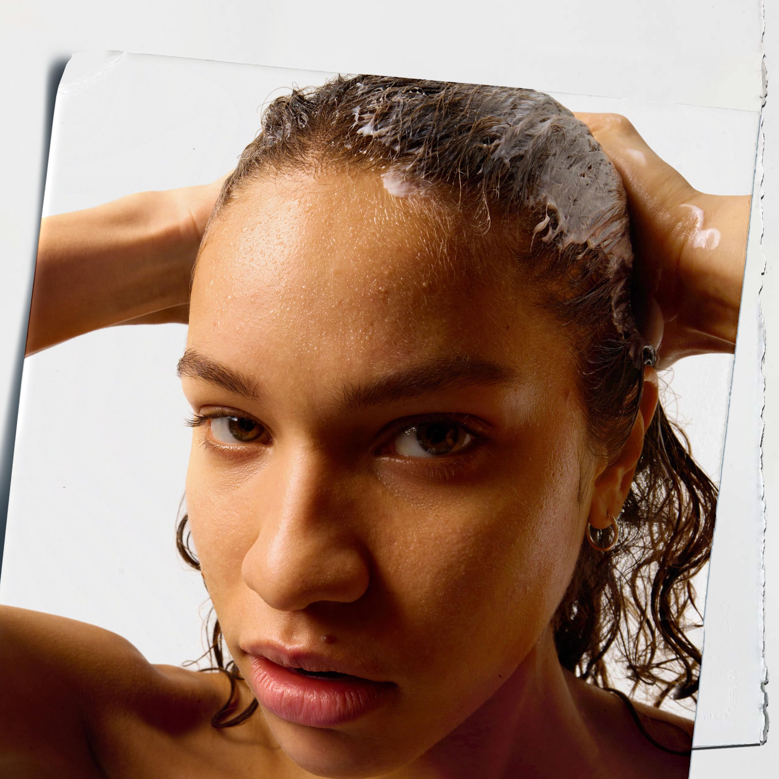 Kiehl's Amino Acid Conditioner cream texture swirl demonstrates a smooth, detangler-friendly experience.