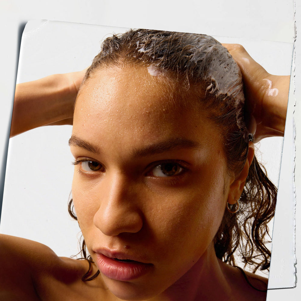 Kiehl's Amino Acid Conditioner cream texture swirl demonstrates a smooth, detangler-friendly experience.