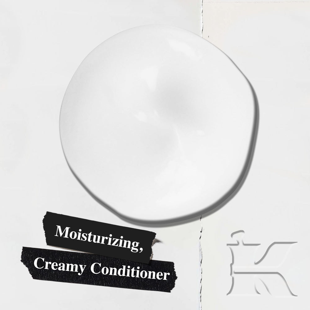 Kiehl's Amino Acid Conditioner label closeup highlights nourishing ingredients like amino acids and coconut oil.