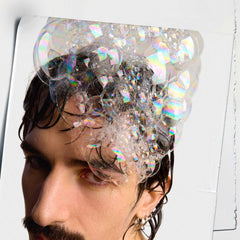 Foam-lather from Kiehl's Amino Acid Shampoo on wet hair for cleansing.