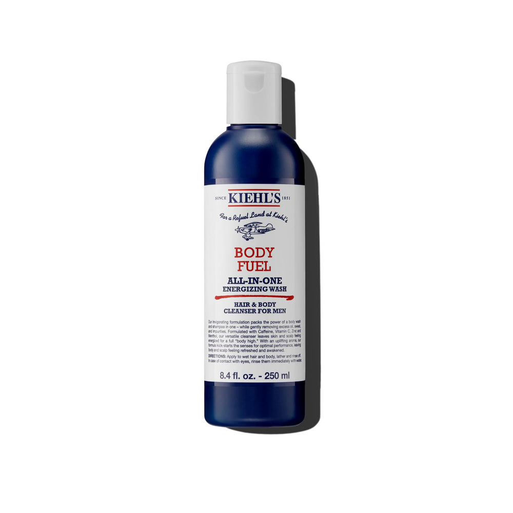 Kiehl's Body Fuel bottle close-up showcases energizing formula for refreshed skin and scalp daily.