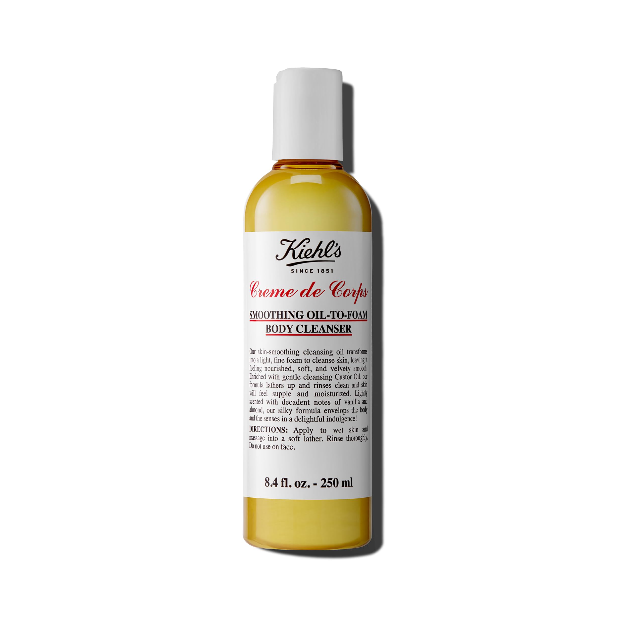Kiehl's Creme de Corps bottle-pour shows gentle cleansing for soft, nourished skin.