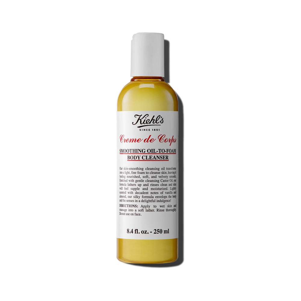 Kiehl's Creme de Corps bottle-pour shows gentle cleansing for soft, nourished skin.