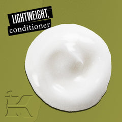 Kiehl's Nourishing Olive Fruit Oil Conditioner ingredient closeup highlights moisture-rich oils for smoother hair.